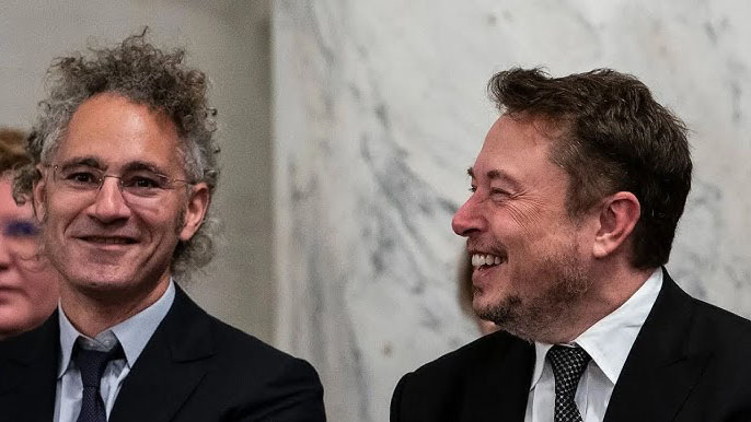 Alex Karp and Elon Musk laughing