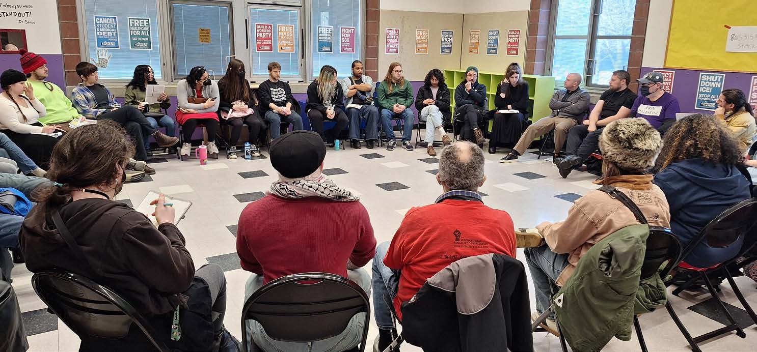 A photo of a room filled with a circle of seated people.